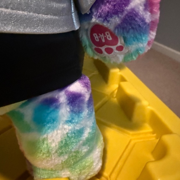 Build-A-Bear Workshop Rainbow Safari Bear plush toy wearing a silver vest - Picture 3 of 4